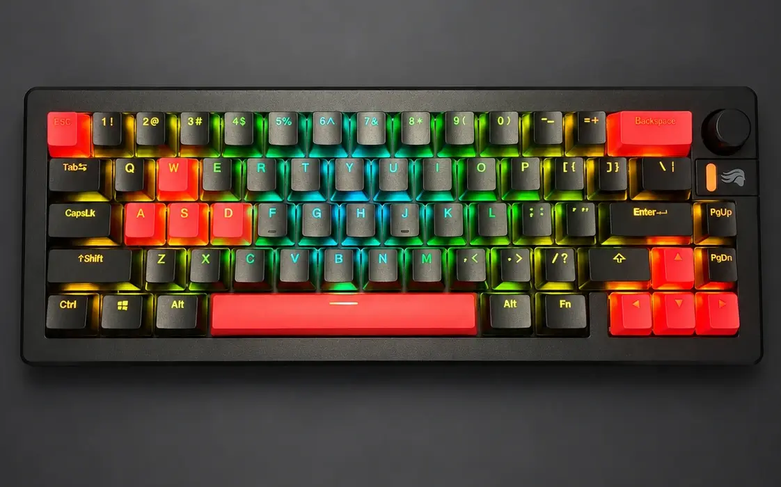 Tightly framed top-down view of Inferno 65 with coral-red accents and vivid RGB