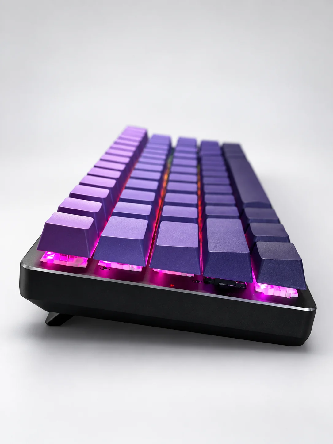 Low angle view showing Nebula 60 keycap height and RGB lighting